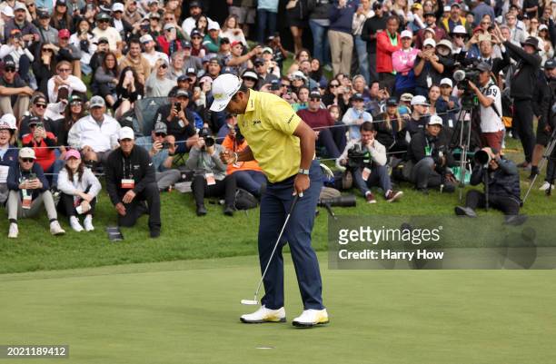 Hideki Matsuyama of Japan reacts to his winning putt on the 18th green during the final round of The Genesis Invitational at Riviera Country Club on...