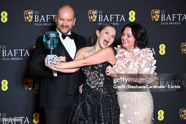 Wayne Mckenna- Bruce, Mia Mckenna-Bruce and Angela Mckenna-Bruce pose with the EE Rising Star Award in the Winners Room at the 2024 EE BAFTA Film...