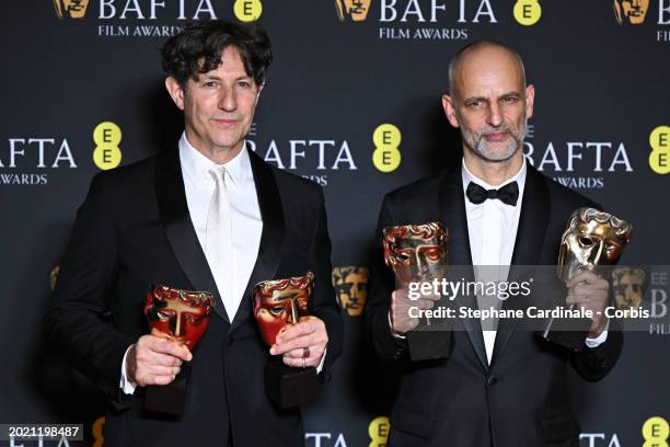 Jonathan Glazer and James Wilson pose with the Outstanding British Film Award and Film Not in the English Language Award for 'The Zone of Interest'...