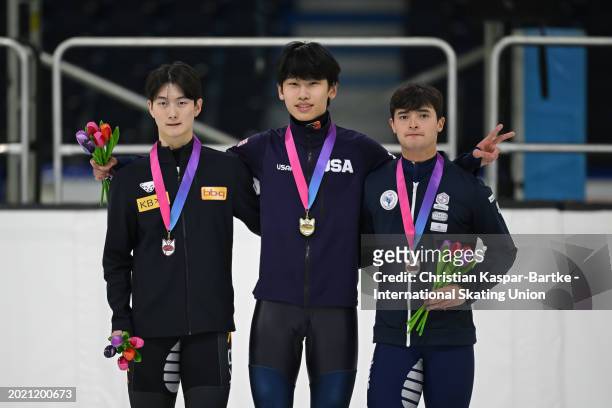 Shin Dong Min of Korea , Sean Shuai of United States and Tawan Thomas of France pose on podium after Men`s 500m medal ceremony during the ISU Junior...