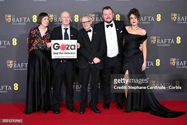Rebecca O'Brien , Paul Laverty and Ken Loach attend the 2024 EE BAFTA Film Awards at The Royal Festival Hall on February 18, 2024 in London, England.