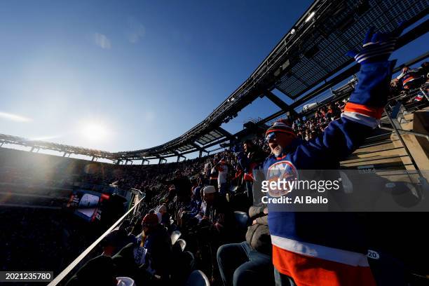 New York Islanders fan celebrates a goal against the New York Rangers during the first period during the 2024 Navy Federal Credit Union Stadium...