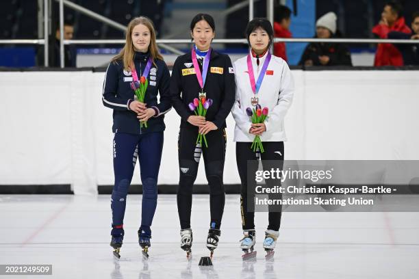 Berenice Comby of France , Chung Jaehee of Korea and Yang Rongmiao of China pose on podium after Women`s 500m medal ceremony during the ISU Junior...