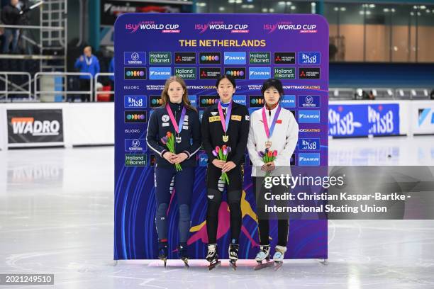 Berenice Comby of France , Chung Jaehee of Korea and Yang Rongmiao of China pose on podium after Women`s 500m medal ceremony during the ISU Junior...