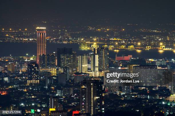 crowded residential building in night - komtar building imagens e fotografias de stock