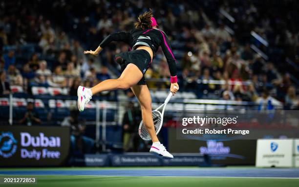 Iga Swiatek of Poland warms in action against Elina Svitolina of Ukraine in the third round on Day 4 of the Dubai Duty Free Tennis Championships,...