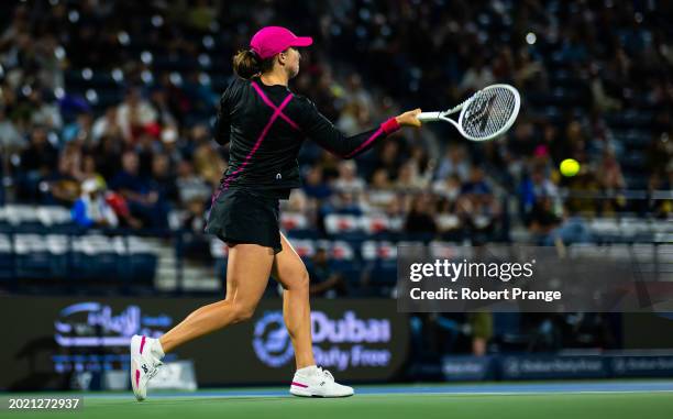 Iga Swiatek of Poland warms in action against Elina Svitolina of Ukraine in the third round on Day 4 of the Dubai Duty Free Tennis Championships,...