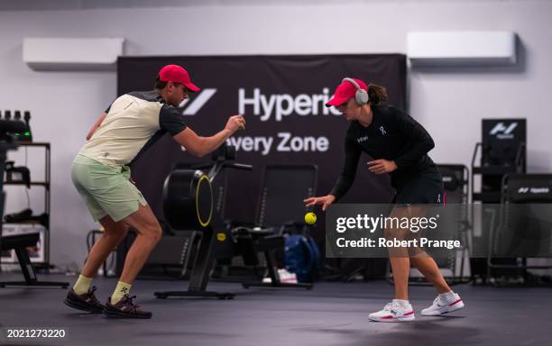 Iga Swiatek of Poland warms up before playing against Elina Svitolina of Ukraine in the third round on Day 4 of the Dubai Duty Free Tennis...