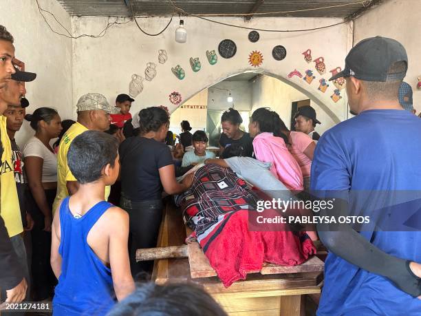 Relatives mourn one of the miners that died after the collapse of a remote illegal mine, in La Paragua, Bolivar state, Venezuela on February 21,...