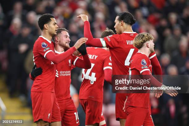 Cody Gakpo of Liverpool celebrates their second goal with his team mates during the Premier League match between Liverpool FC and Luton Town at...