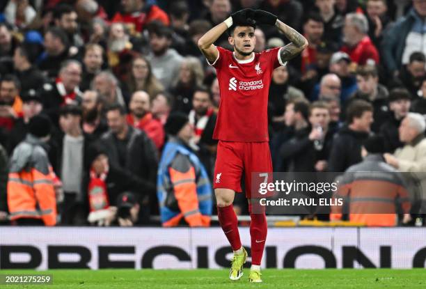 Liverpool's Colombian midfielder Luis Diaz celebrates after scoring his team third goal during the English Premier League football match between...