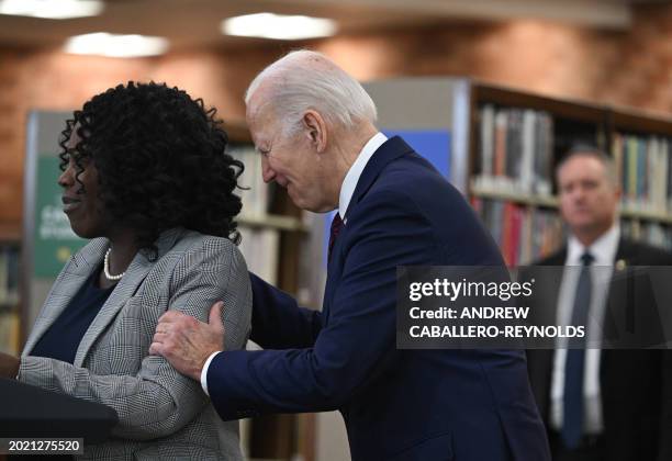 President Joe Biden embraces Culver City mayor Yasmine Imani-McMorrin as she introduces him during an event to announce that his Administration has...