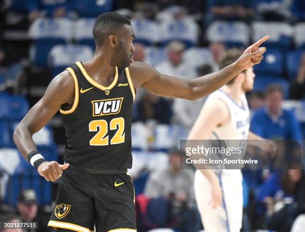 Virginia Commonwealth guard Joe Bamisile gestures after scoring during a college basketball game between the Virginia Commonwealth Rams and the Saint...