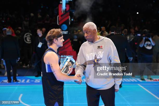 Mac McClung of the Osceola Magic and Julius Erving shake hands after the 2024 AT&T Slam Dunk contest during the State Farm All-Star Saturday Night on...