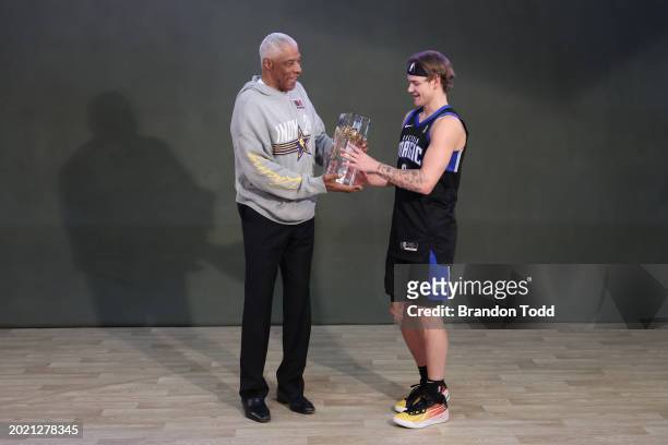 Mac McClung of the Osceola Magic and Julius Erving pose for a photo after the 2024 AT&T Slam Dunk contest during the State Farm All-Star Saturday...