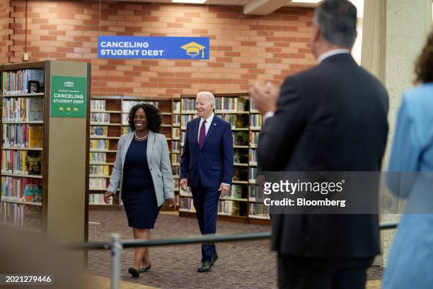 President Joe Biden, center, and Dr. Jessica Saint-Paul, left, arrive at the Culver City Julian Dixon Library in Culver City, California, US, on...