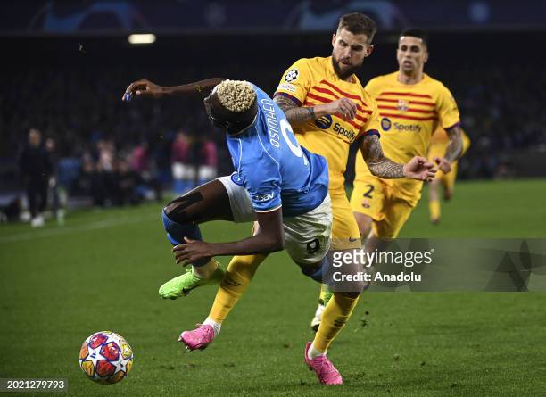 Victor James Osimhen , of Napoli, in action against Inigo Martinez , of FC Barcelona, during the UEFA Champions League round of 16 first leg football...
