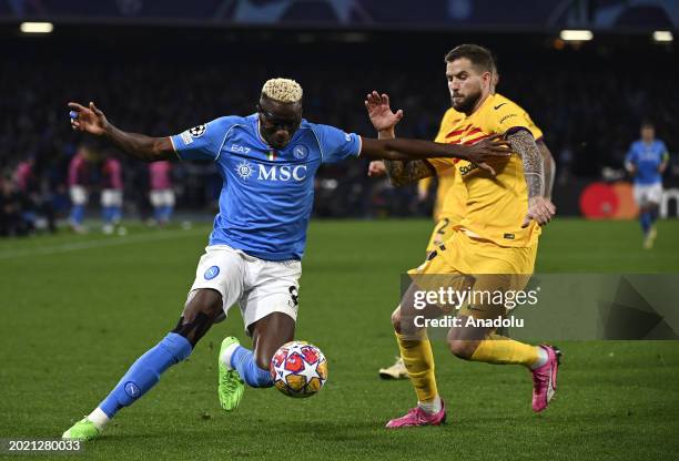 Victor James Osimhen , of Napoli, in action against Inigo Martinez , of FC Barcelona, during the UEFA Champions League round of 16 first leg football...