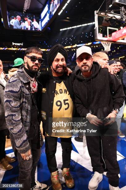Anuel AA, Nav Bhatia and Dominic Ciambrone pose for a photo during the NBA All-Star Game as part of NBA All-Star Weekend on Sunday, February 18, 2024...