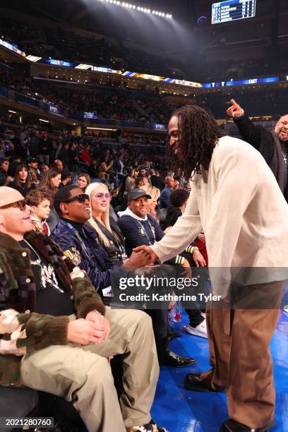 Baby Face and Andre Iguodala shake hands during the NBA All-Star Game as part of NBA All-Star Weekend on Sunday, February 18, 2024 at Gainbridge...