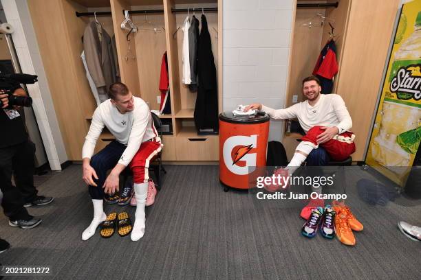 Nikola Jokic of the Denver Nuggets and Luka Doncic of the Dallas Mavericks sit in the locker room during the NBA All-Star Game as part of NBA...