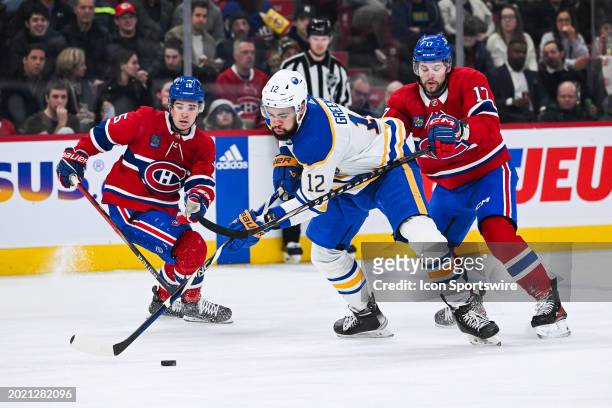 Buffalo Sabres left wing Jordan Greenway plays the puck against Montreal Canadiens right wing Josh Anderson during the Buffalo Sabres versus the...