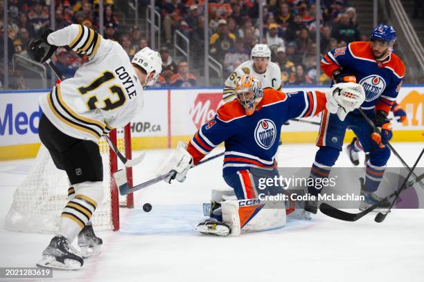 Goaltender Stuart Skinner of the Edmonton Oilers makes a save against Charlie Coyle of the Boston Bruins during the first period at Rogers Place on...