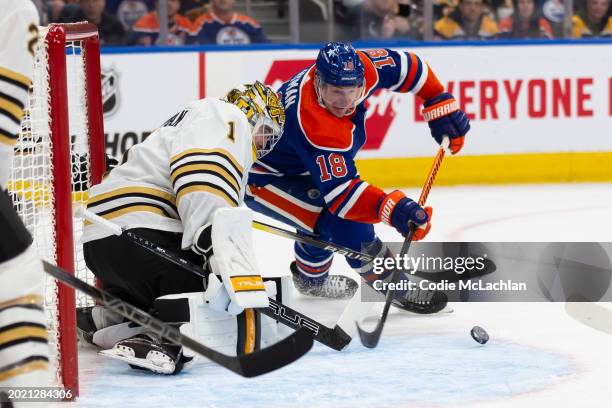 Zach Hyman of the Edmonton Oilers goes for a wraparound against goaltender Jeremy Swayman of the Boston Bruins during the second period at Rogers...