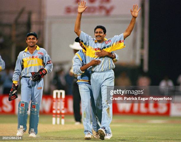 Anil Kumble of India is congratulated by teammate Ajay Jadeja on one of his three wickets during the Wills World Cup quarter-final between India and...