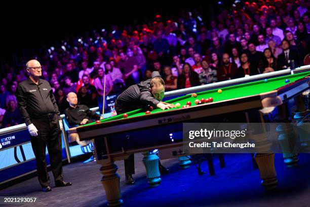 Martin O'Donnell of England plays a shot in the Final match against Gary Wilson of England on day seven of 2024 Betvictor Welsh Open at Venue Cymru...