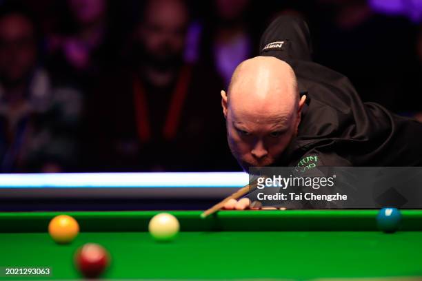 Gary Wilson of England plays a shot in the Final match against Martin O'Donnell of England on day seven of 2024 Betvictor Welsh Open at Venue Cymru...