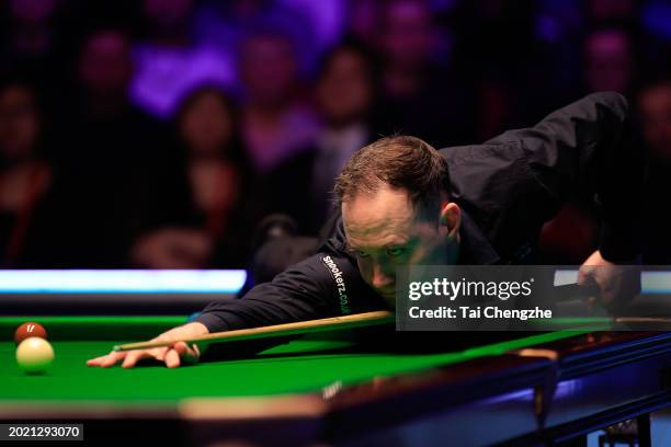 Martin O'Donnell of England plays a shot in the Final match against Gary Wilson of England on day seven of 2024 Betvictor Welsh Open at Venue Cymru...