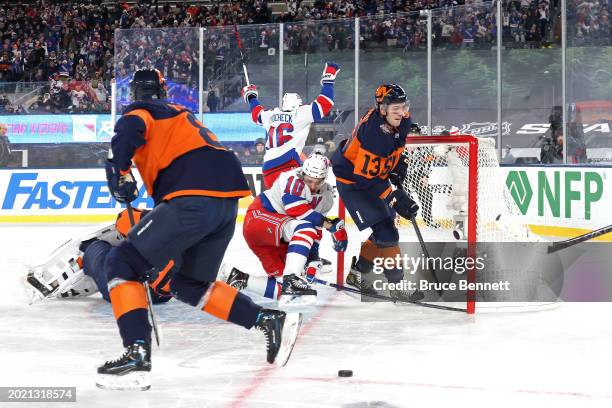 Artemi Panarin of the New York Rangers scores the game-winning goal in overtime past Ilya Sorokin of the New York Islanders during the 2024 Navy...