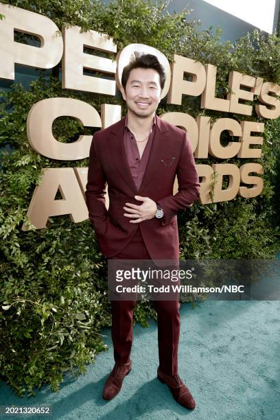 Pictured: Simu Liu arrives to the 2024 People's Choice Awards held at Barker Hangar on February 18, 2024 in Santa Monica, California. --