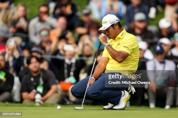 Hideki Matsuyama of Japan lines up his putt on the 18th hole during the final round of The Genesis Invitational at Riviera Country Club on February...