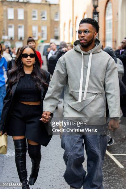 Couple Jamila & Daniel Sturridge wears grey hoody outside JW Anderson during London Fashion Week February 2024 on February 18, 2024 in London,...