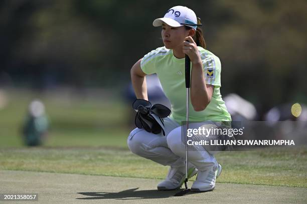 Hinako Shibuno of Japan lines up a shot during the first day of the 2024 Honda LPGA Thailand golf tournament at the Siam Country Club in Pattaya on...