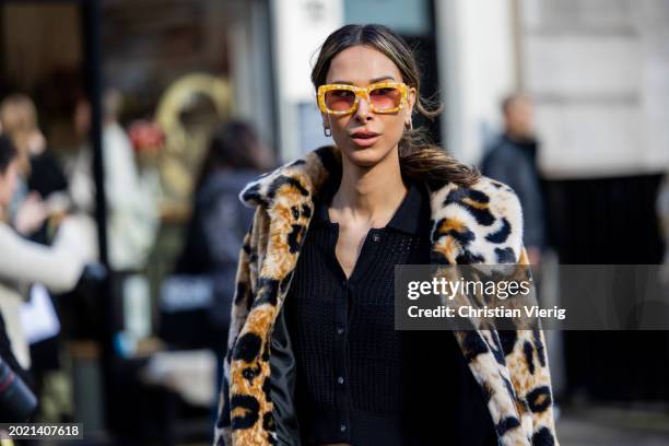 Isabella Charlotta Poppius wears animal print jacket, black cardigan, sunglasses outside Eudon Choi during London Fashion Week February 2024 on...