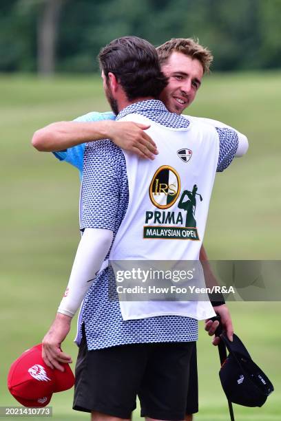 David Puig of Spain hugs his caddie Alberto Sanchez after winning the tournament during day four of the IRS Prima Malaysian Open at The MINES Resort...