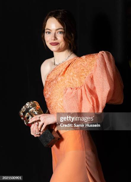Emma Stone poses in the Winners Room with the Leading Actress Award during the EE BAFTA Film Awards 2024 at The Royal Festival Hall on February 18,...