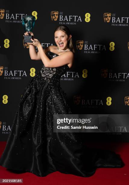 Mia Mckenna-Bruce poses with the EE Rising Star Award in the Winners Room during the EE BAFTA Film Awards 2024 at The Royal Festival Hall on February...