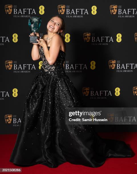 Mia Mckenna-Bruce poses with the EE Rising Star Award in the Winners Room during the EE BAFTA Film Awards 2024 at The Royal Festival Hall on February...