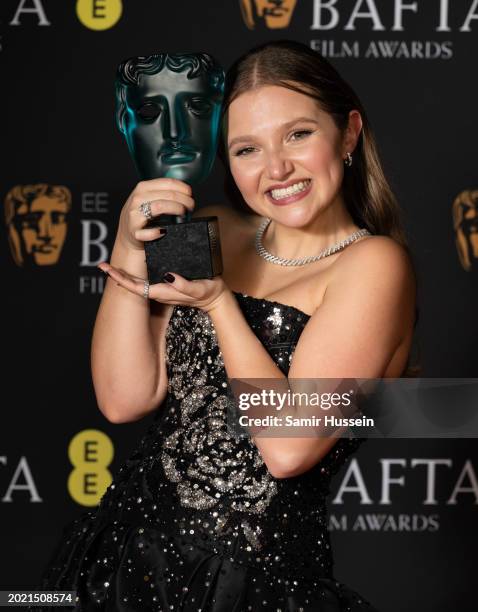 Mia Mckenna-Bruce poses with the EE Rising Star Award in the Winners Room during the EE BAFTA Film Awards 2024 at The Royal Festival Hall on February...