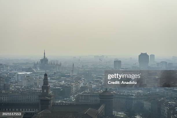 An aerial view of downtown Milan and the Duomo Cathedral during heavy pollution in Milan, Italy on February 21, 2024. The city is facing dangerous...