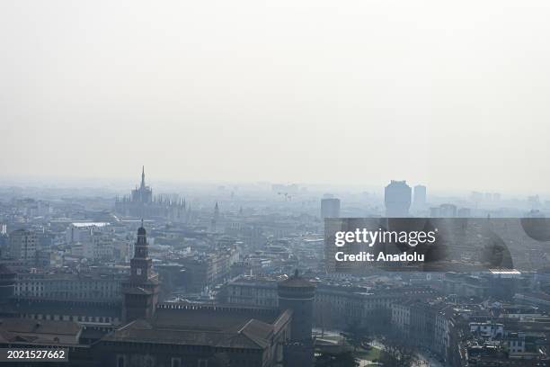 An aerial view of downtown Milan and the Duomo Cathedral during heavy pollution in Milan, Italy on February 21, 2024. The city is facing dangerous...