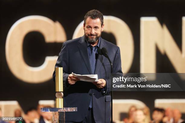 Pictured: Adam Sandler accepts the People's Icon Award onstage during the 2024 People's Choice Awards held at Barker Hangar on February 18, 2024 in...