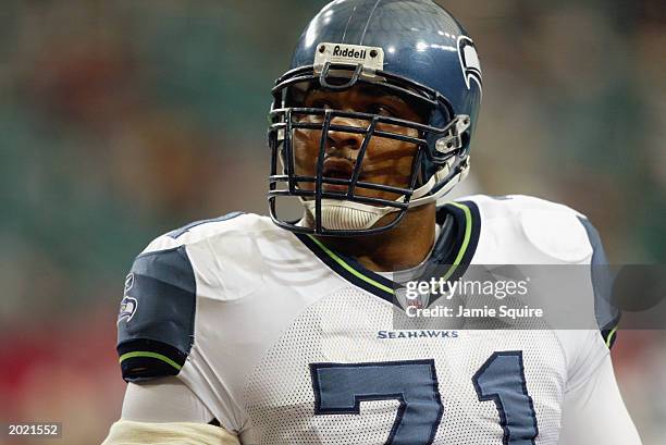 Tackle Walter Jones of the Seattle Seahawks looks on during warm-ups prior to the NFL game against the Atlanta Falcons at the Georgia Dome on...