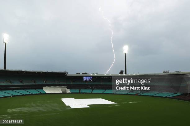 Lightning strike is seen as rain and bad light stop play during the Sheffield Shield match between New South Wales and Victoria at SCG, on February...