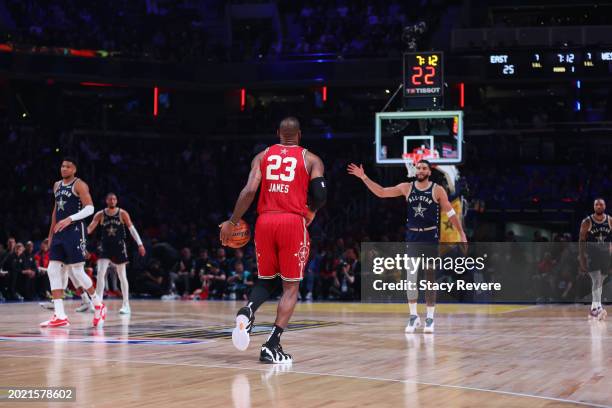 LeBron James of the Los Angeles Lakers and Western Conference All-Stars dribbles the ball against the Eastern Conference All-Stars in the first...