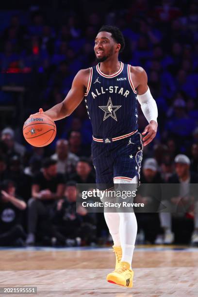 Donovan Mitchell of the Cleveland Cavaliers and Eastern Conference All-Stars dribbles the ball against the Western Conference All-Stars in the first...